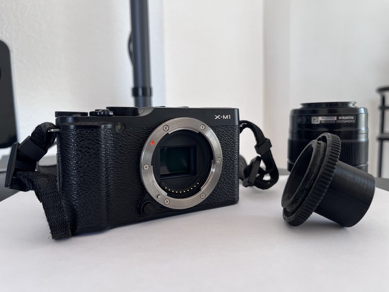 Fujifilm X-M1 body and the 3D-printed 1.25-inch telescope adapter.
